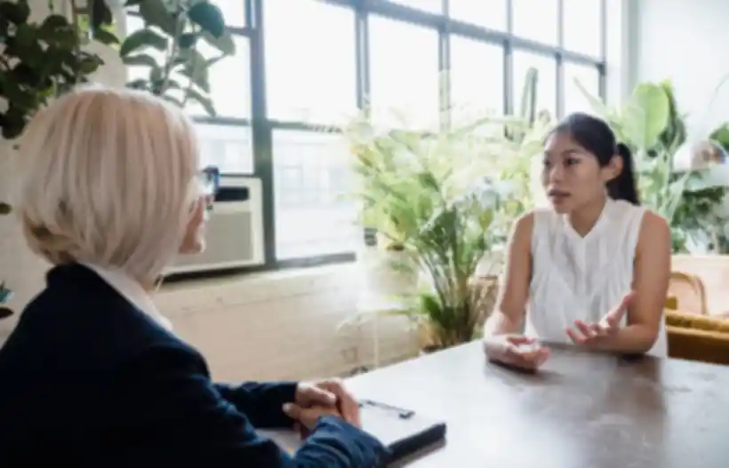 A student meeting with a support adviser
